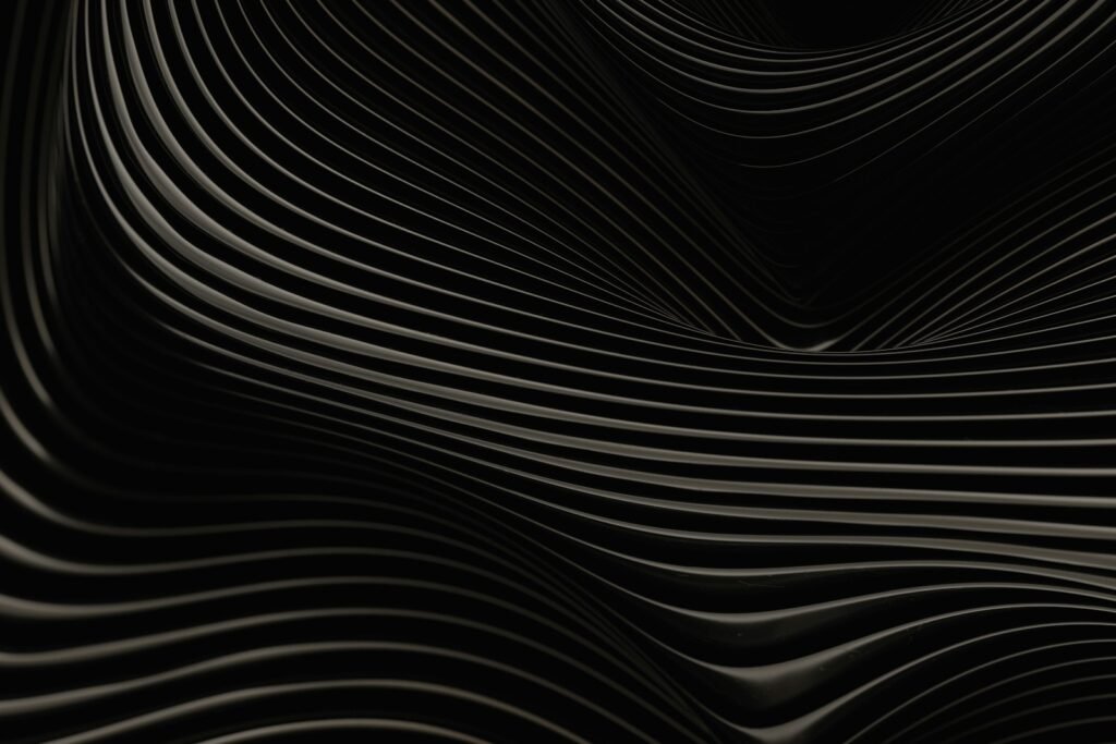 An abstract black and white background with wavy lines